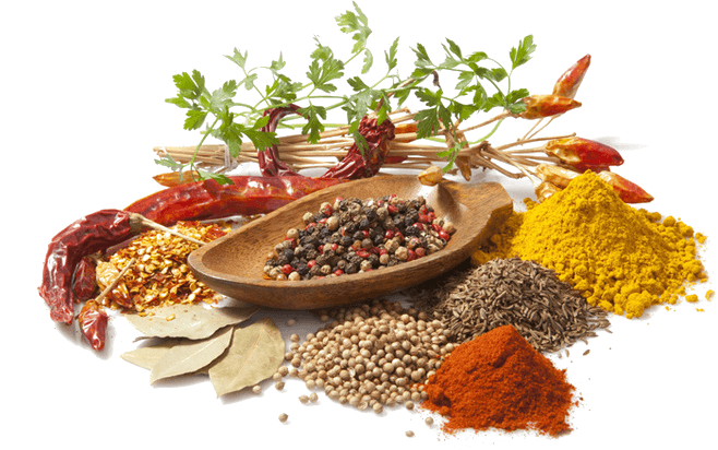 A colorful assortment of whole and ground spices.